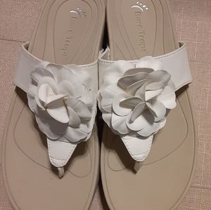 Bare Traps white sandals with flower accent.